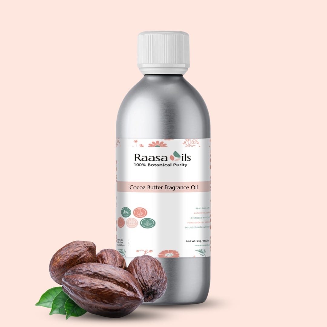 Bottle of Raasa Oils Cocoa Butter Fragrance Oil with cocoa butter and leaves on a beige background