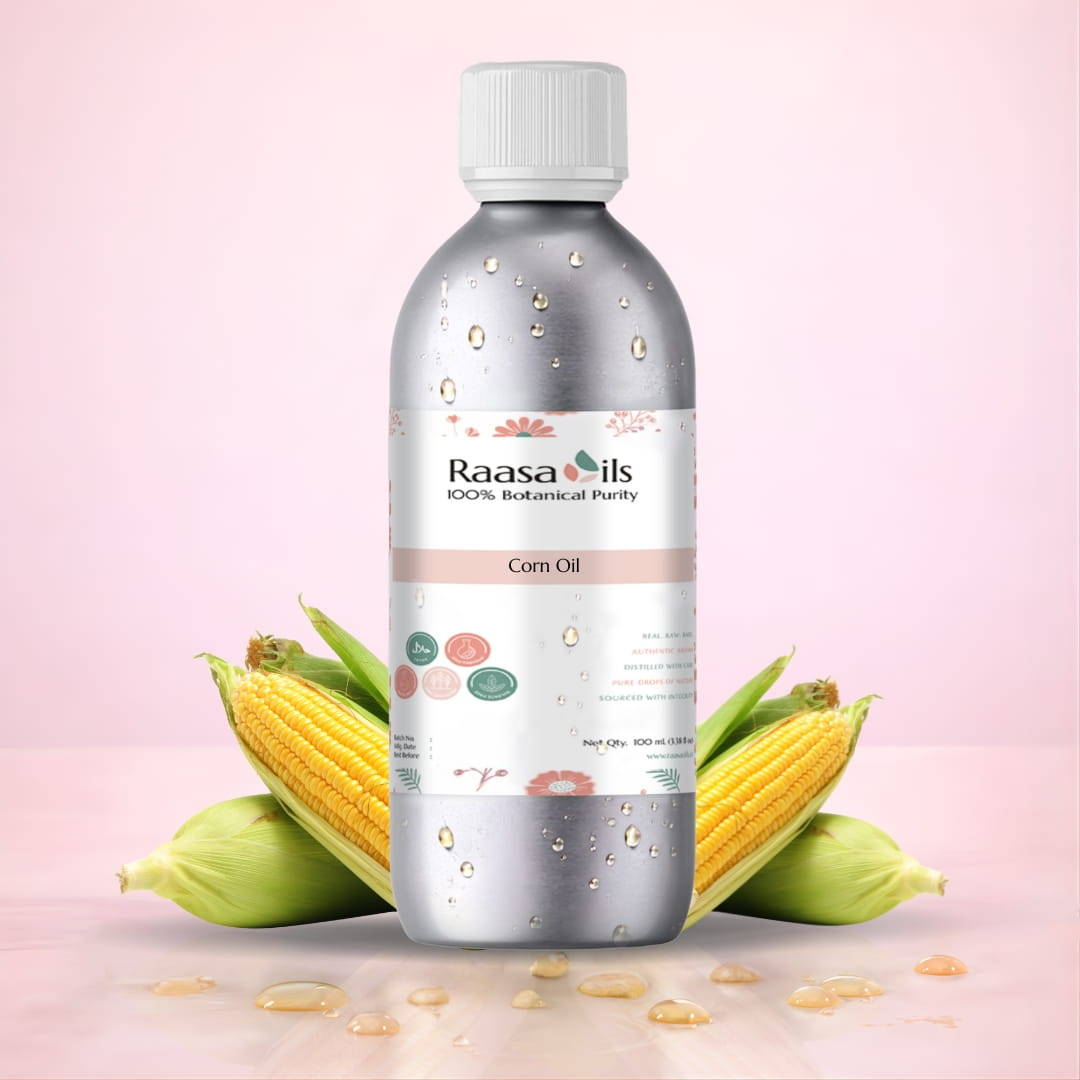 Bottle of Raasa Oils corn oil with corn kernels on a pink background