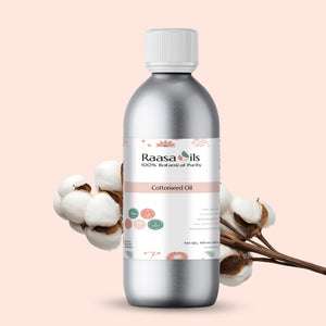 Bottle of Raasa Oils Cottonseed Oil with cotton plant on a beige background