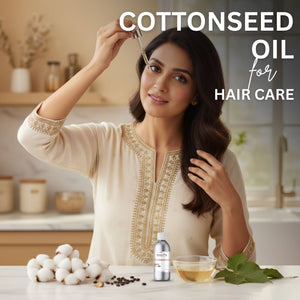 Woman with long hair holding a dropper over her head, with cottonseed oil products on a kitchen counter.