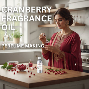 Woman in a kitchen with cranberry fragrance oil and ingredients on a counter.