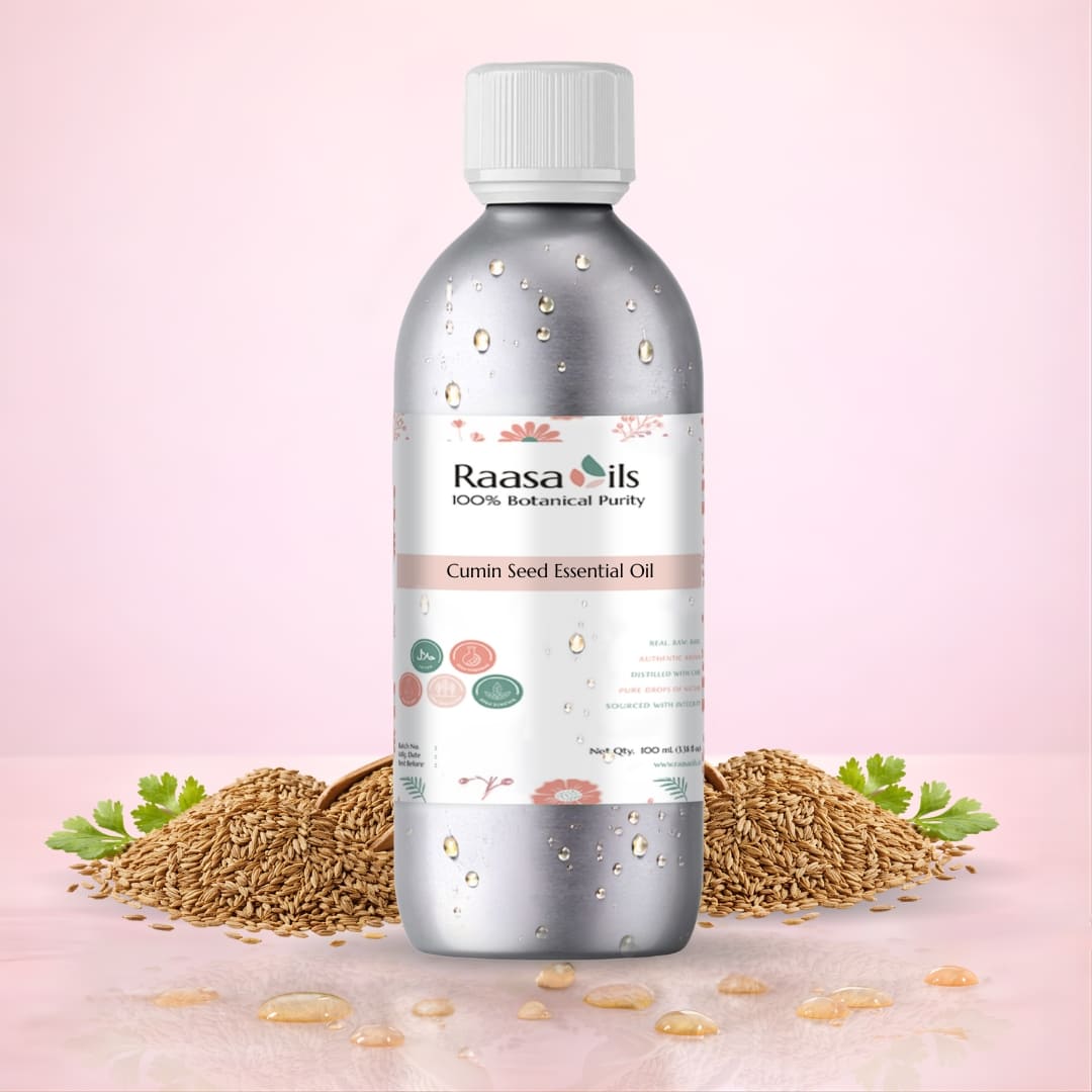 Bottle of Raasa Oils Cumin Seed Essential Oil with cumin seeds on a pink background