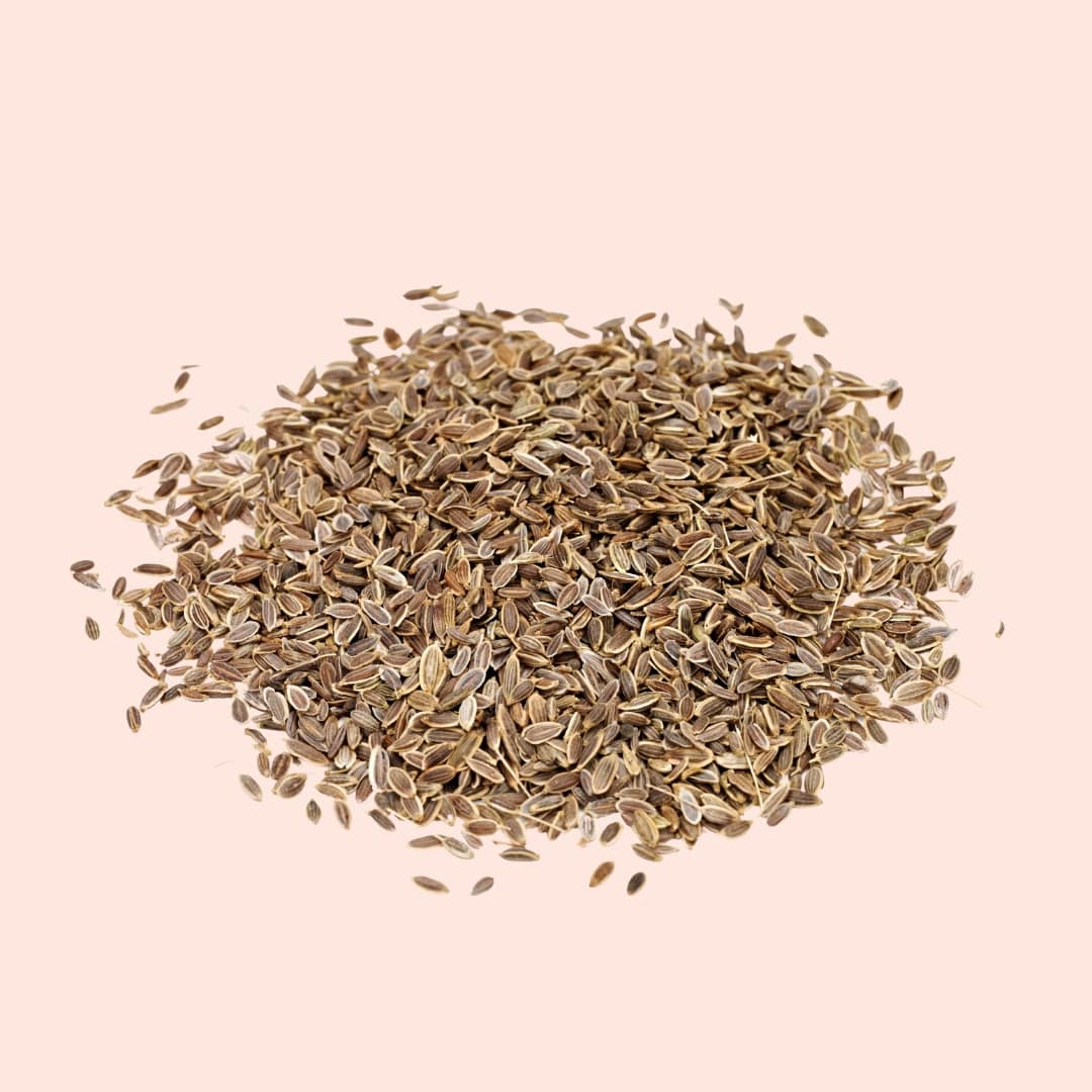 Heap of dried herbs on a beige background
