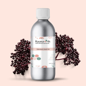 Bottle of Raasa Oils Elderberry Seed Oil with elderberries on a beige background