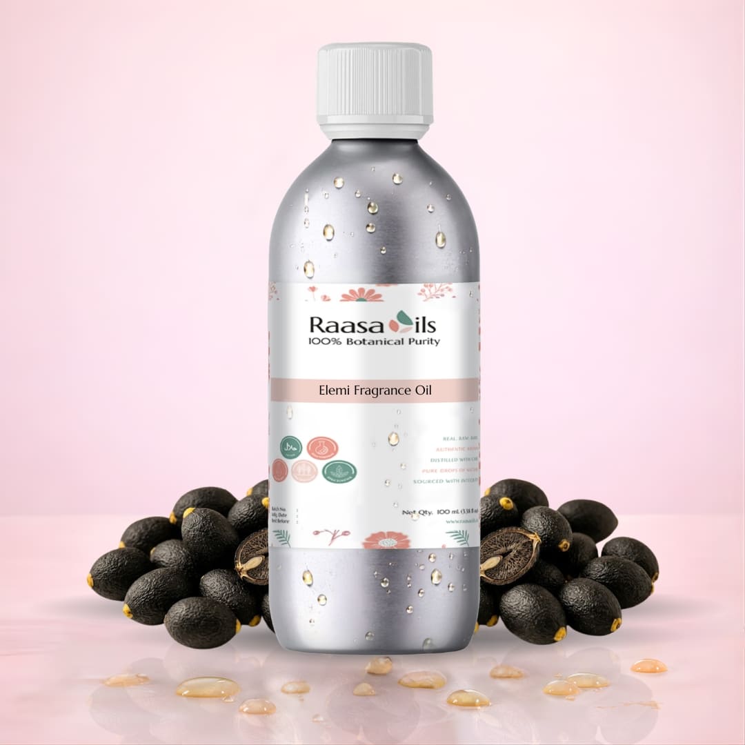 Bottle of Raasa Oils Elemi Fragrance Oil with elemi fruits on a pink background