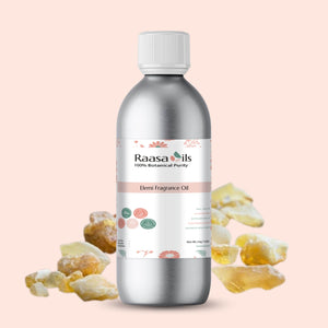 Bottle of Raasa Oils Bemi Fragrance Oil with frankincense resin on a light pink background