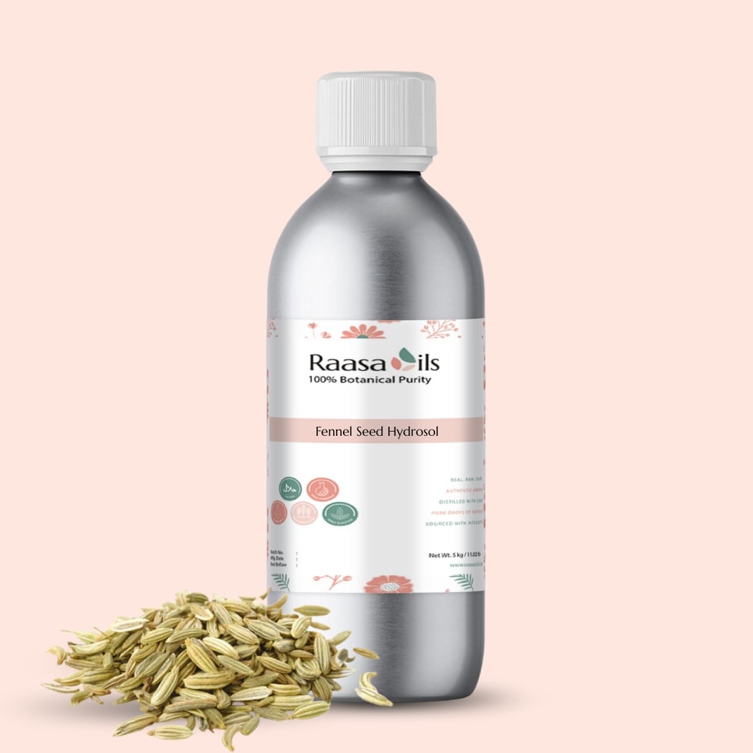 Bottle of Raasa Oils Fennel Seed Hydrosol with fennel seeds on a light pink background
