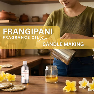 Person pouring frangipani fragrance oil into a jar with flowers and containers in the background.