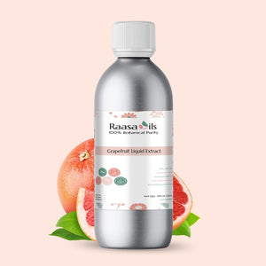 Bottle of Raasa Oils Grapefruit Liquid Extract with a pink background