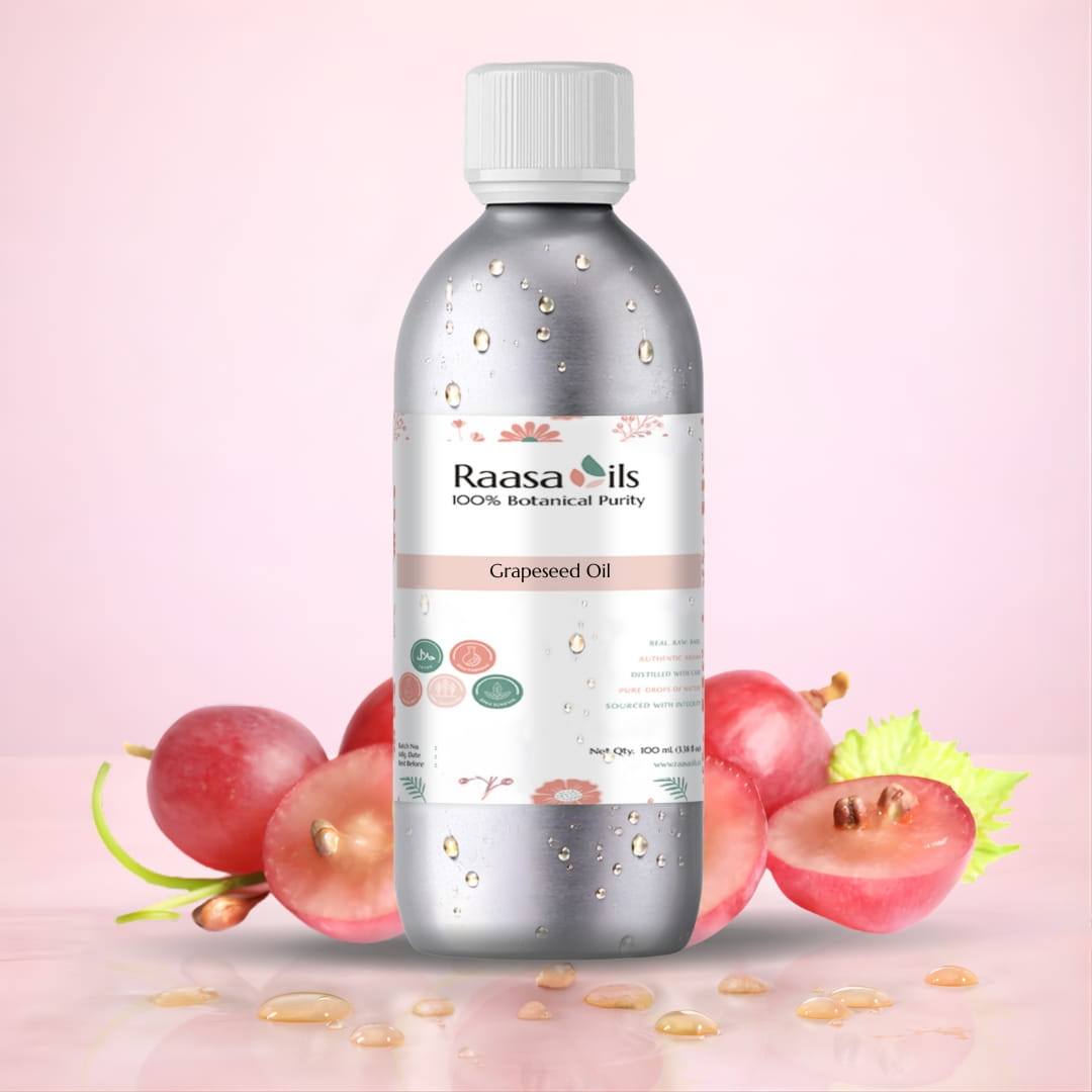 Bottle of Raasa Oils Grapeseed Oil with grapes on a pink background