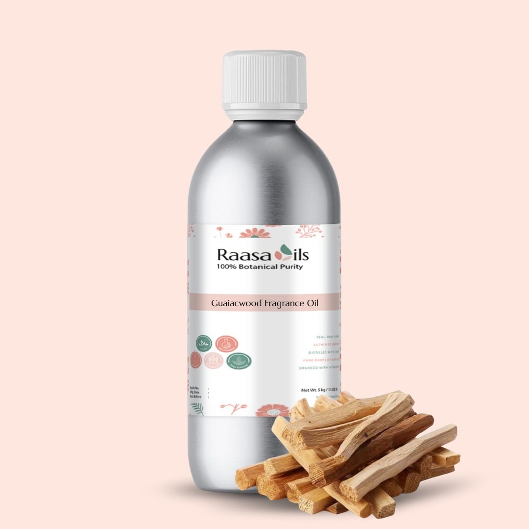 Raasa Oils Guaiawood Fragrance Oil bottle with wooden sticks on a beige background