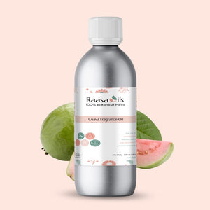 Bottle of Raasa Oils Guava Fragrance Oil with guava fruit on a light pink background