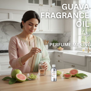 Woman in a kitchen preparing guava fragrance oil with guava fruits on a table.