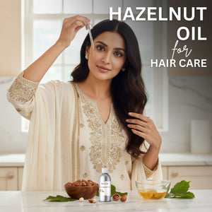 Woman with long hair holding a bottle of hazelnut oil for hair care in a kitchen setting.