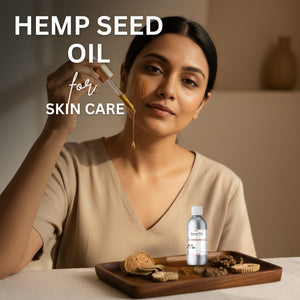 Woman applying hemp seed oil to her face with a dropper, surrounded by a bottle and cookies on a wooden tray.