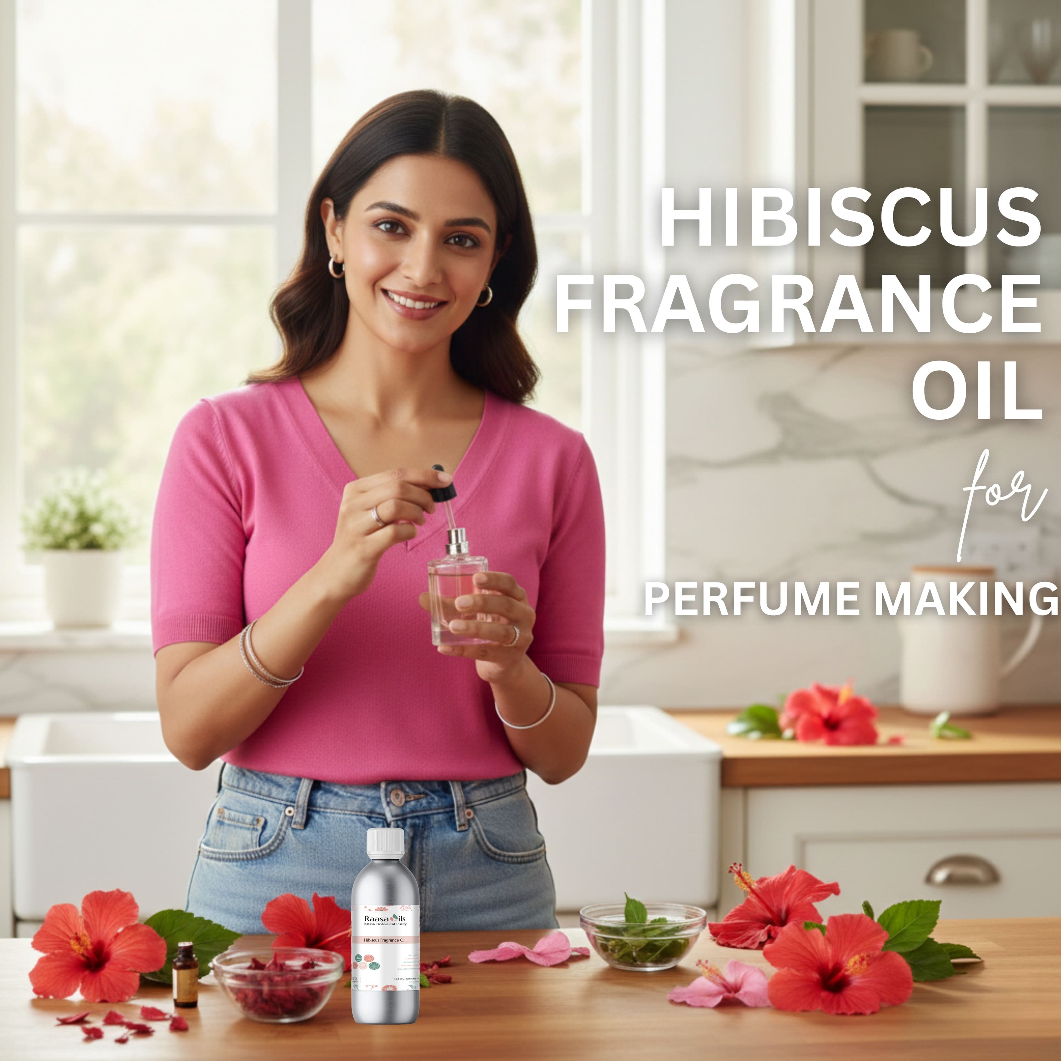 Woman holding a bottle of hibiscus fragrance oil with flowers and ingredients on a table.