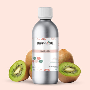 Bottle of Raasa Oils Kiwi Seed Oil with kiwi fruits on a beige background
