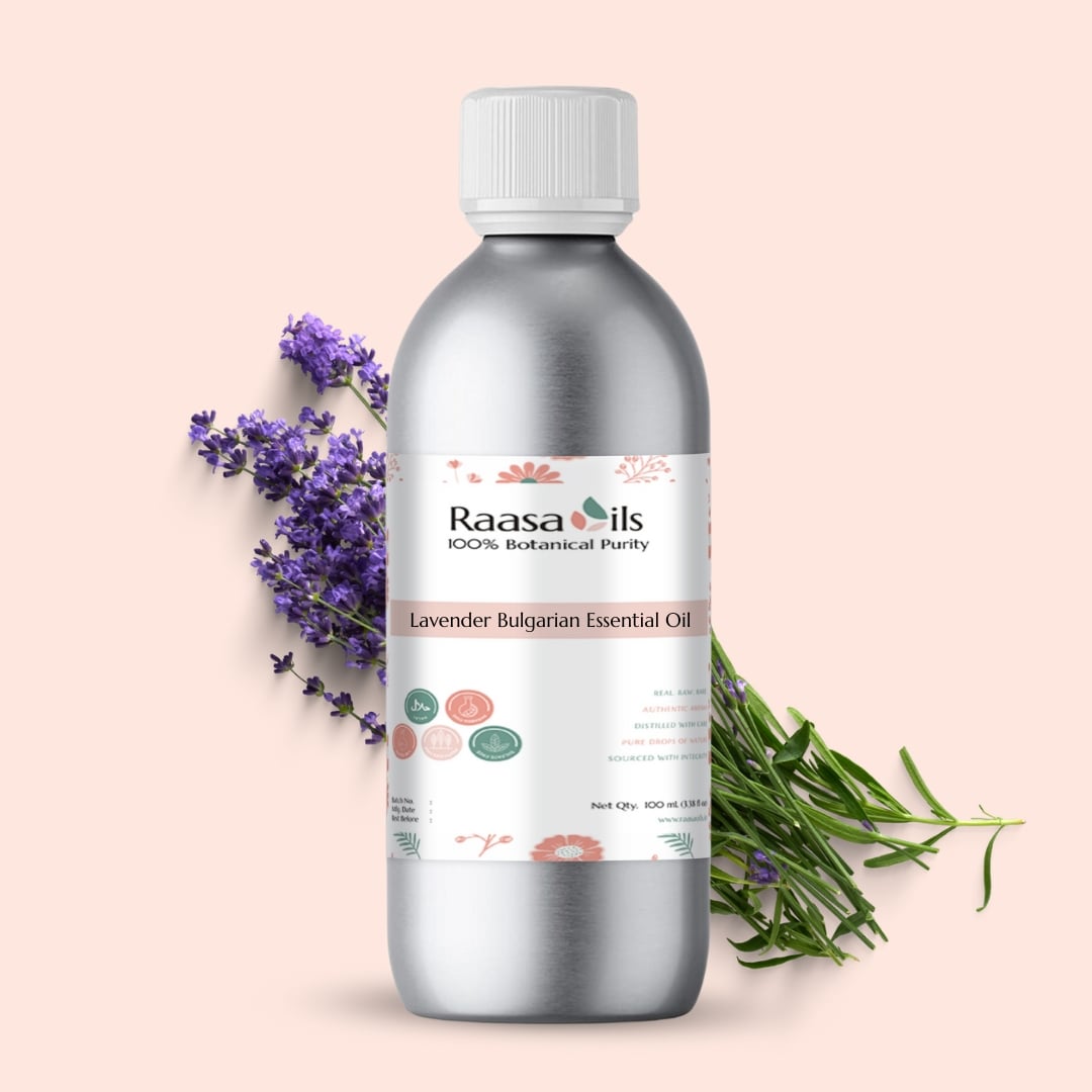 Raasa Oils Lavender Bulgarian Essential Oil bottle with lavender flowers on a light pink background