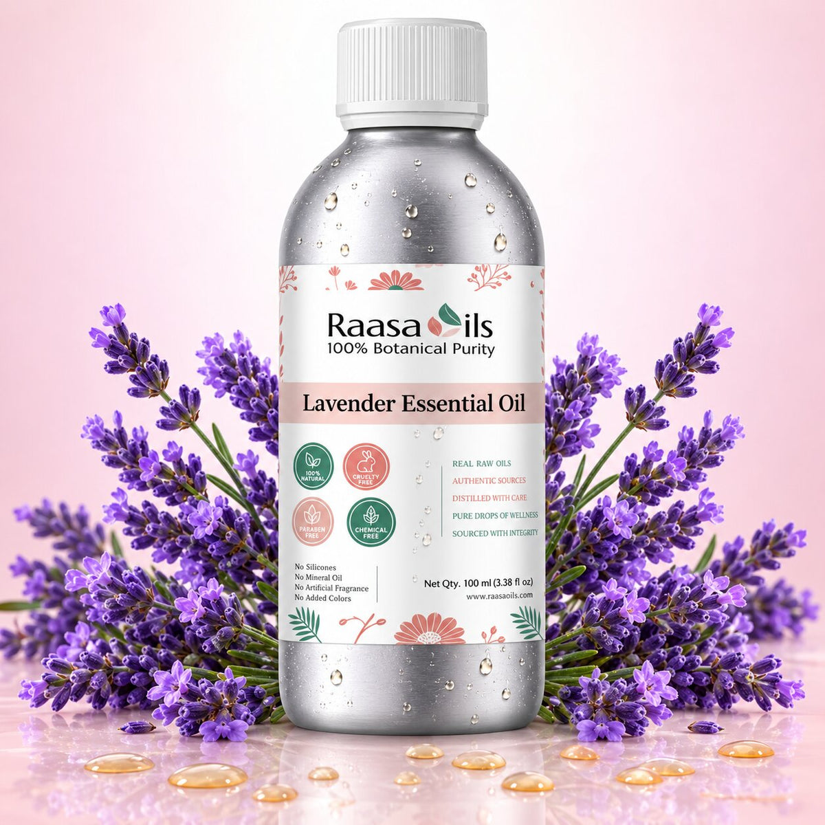 Raasa Oils lavender essential oil bottle with lavender flowers on a pink background