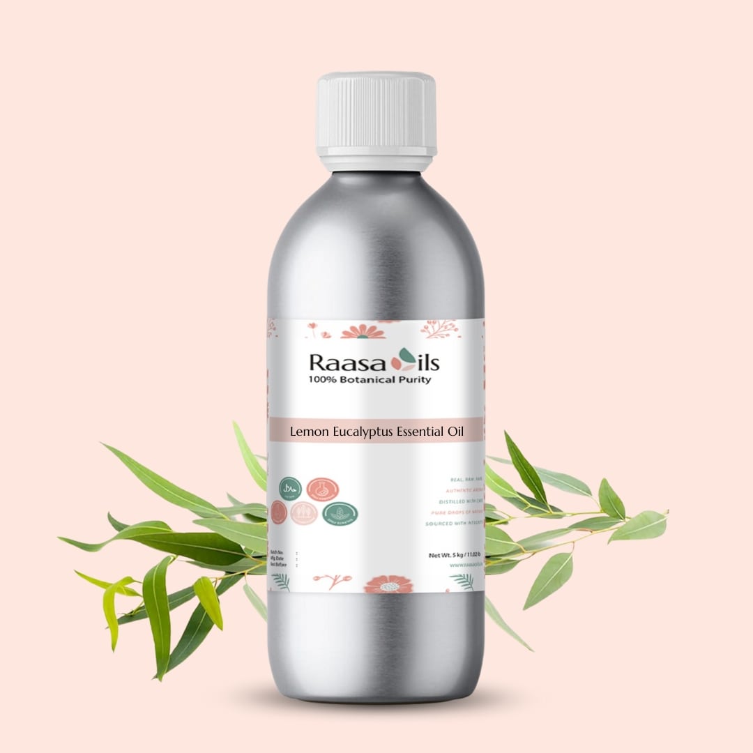 Silver bottle of Raasa Oils Lemon Eucalyptus Essential Oil with green leaves on a light pink background