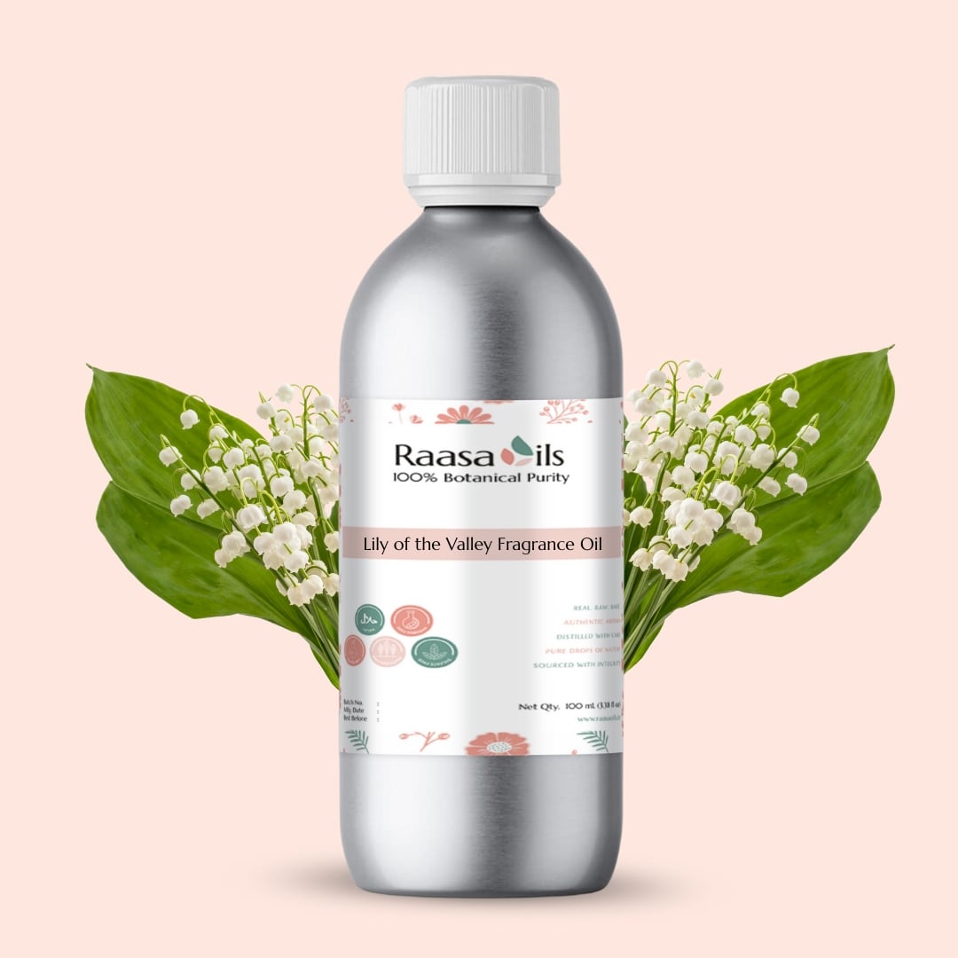 Raasa Oils Lily of the Valley Fragrance Oil bottle with flowers on a beige background