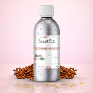 Bottle of Raasa Oils Makhani Seed Oil with seeds on a pink background