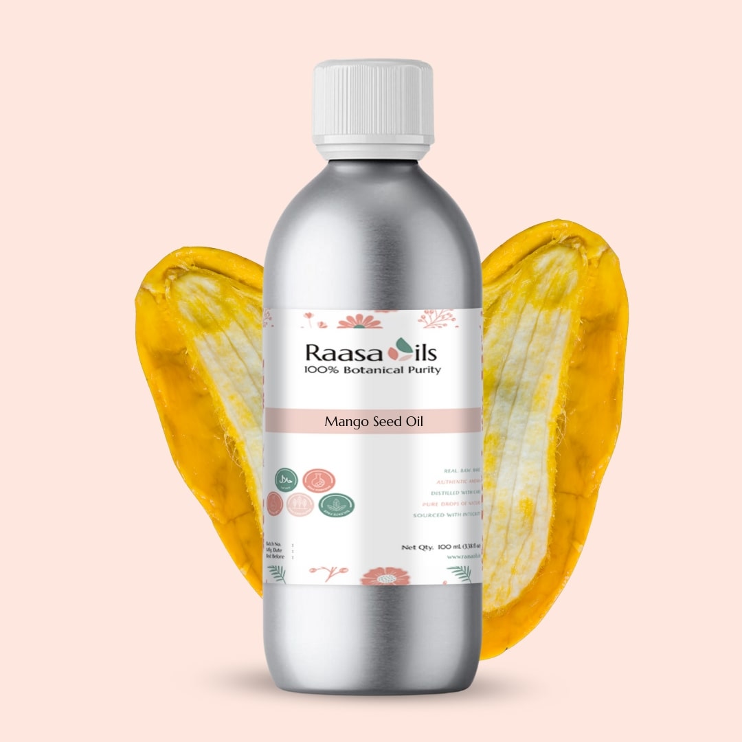 Bottle of Raasa Oils Mango Seed Oil with a mango slice on a light pink background
