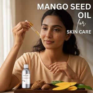 Woman using mango seed oil for skincare with a bottle and ingredients on a tray.