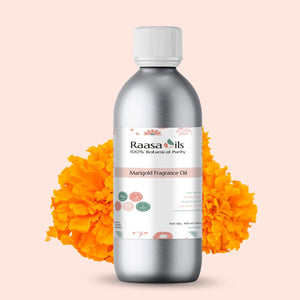 Bottle of Raasa Oils Marigold Fragrance Oil with marigold flowers on a light pink background
