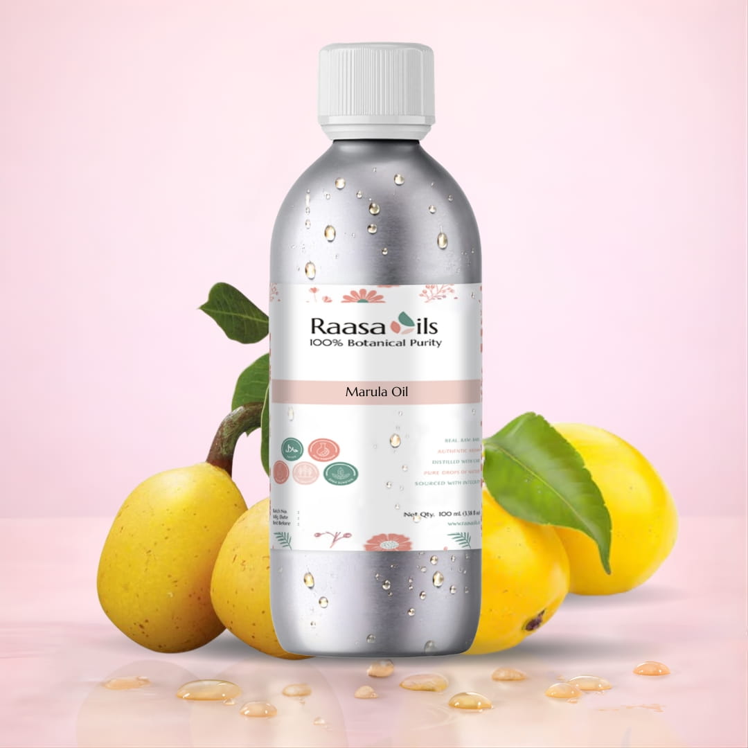 Raasa Oils bottle with marula oil and fruits on a pink background
