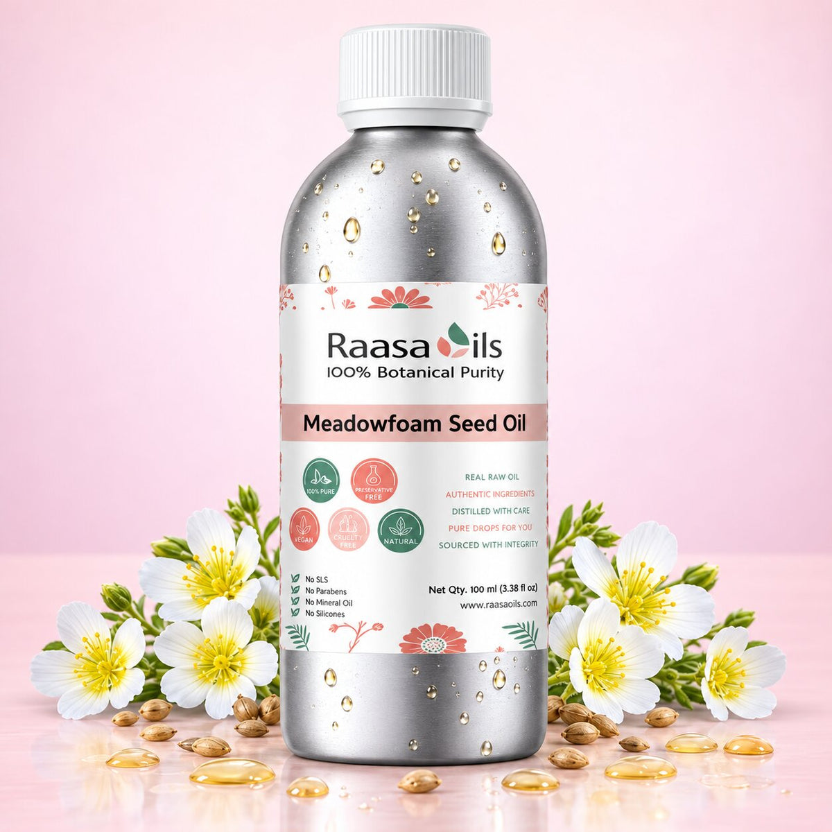 A bottle of Raasails Meadowfoam Seed Oil centered on a pink studio background, surrounded by white flowers, loose seeds, and golden oil droplets. The bottle is metallic silver with a white cap and a white label featuring pink and green accents.