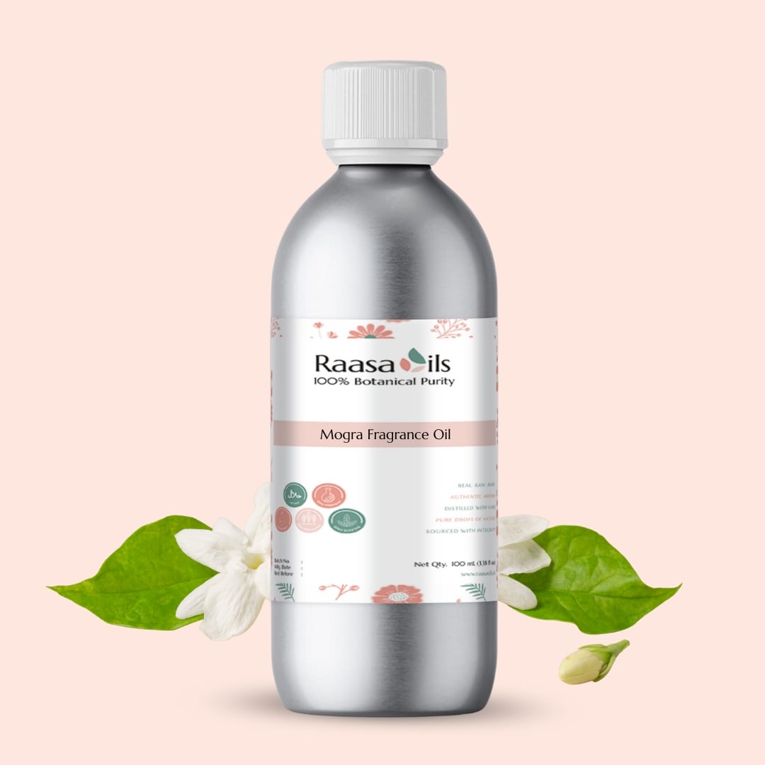 Raasa Oils MoGRA Fragrance Oil bottle with leaves on a light pink background
