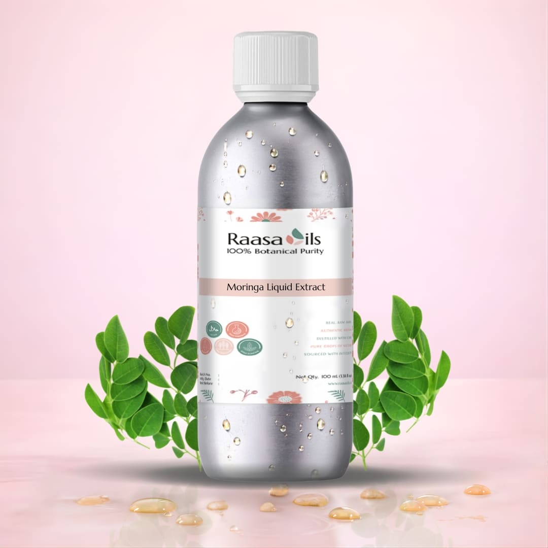 Bottle of Raasa Oils Moringa Liquid Extract with green leaves on a pink background