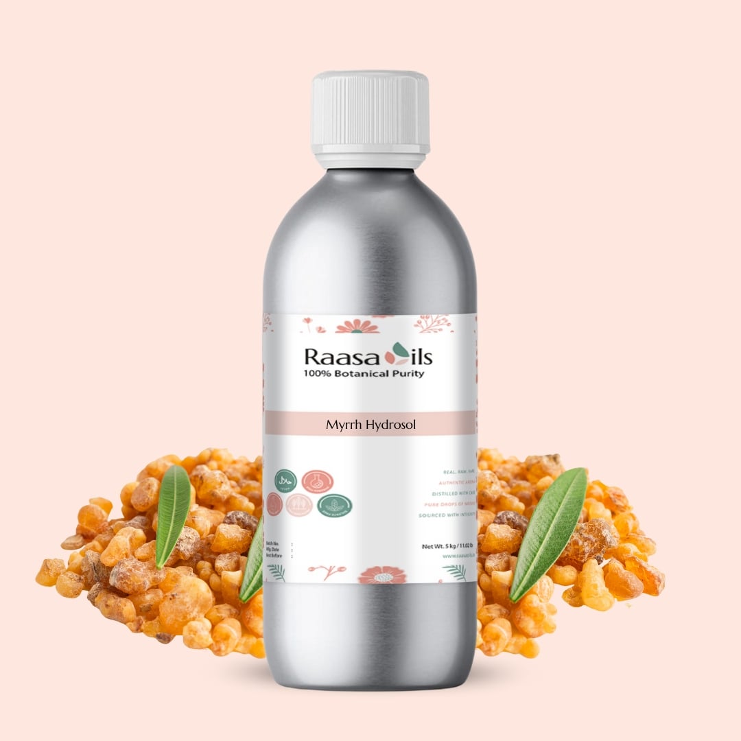 Raasa Oils bottle with myrrh resin on a light pink background
