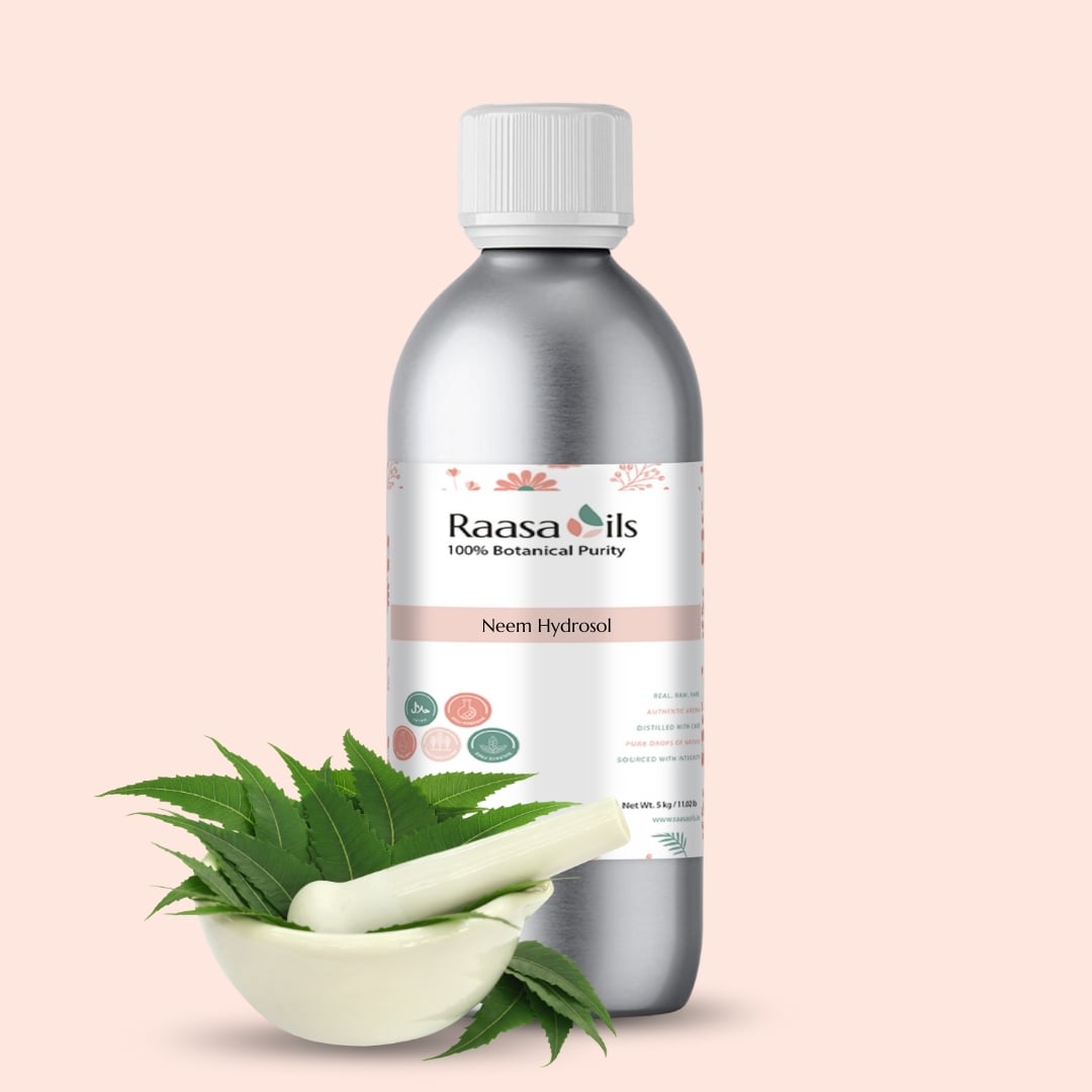 Raasa Oils Neem Hydrosol bottle with neem leaves and a pestle on a light pink background