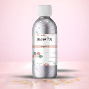 Bottle of Raasa Oils Nirgundi Oil on a pink background