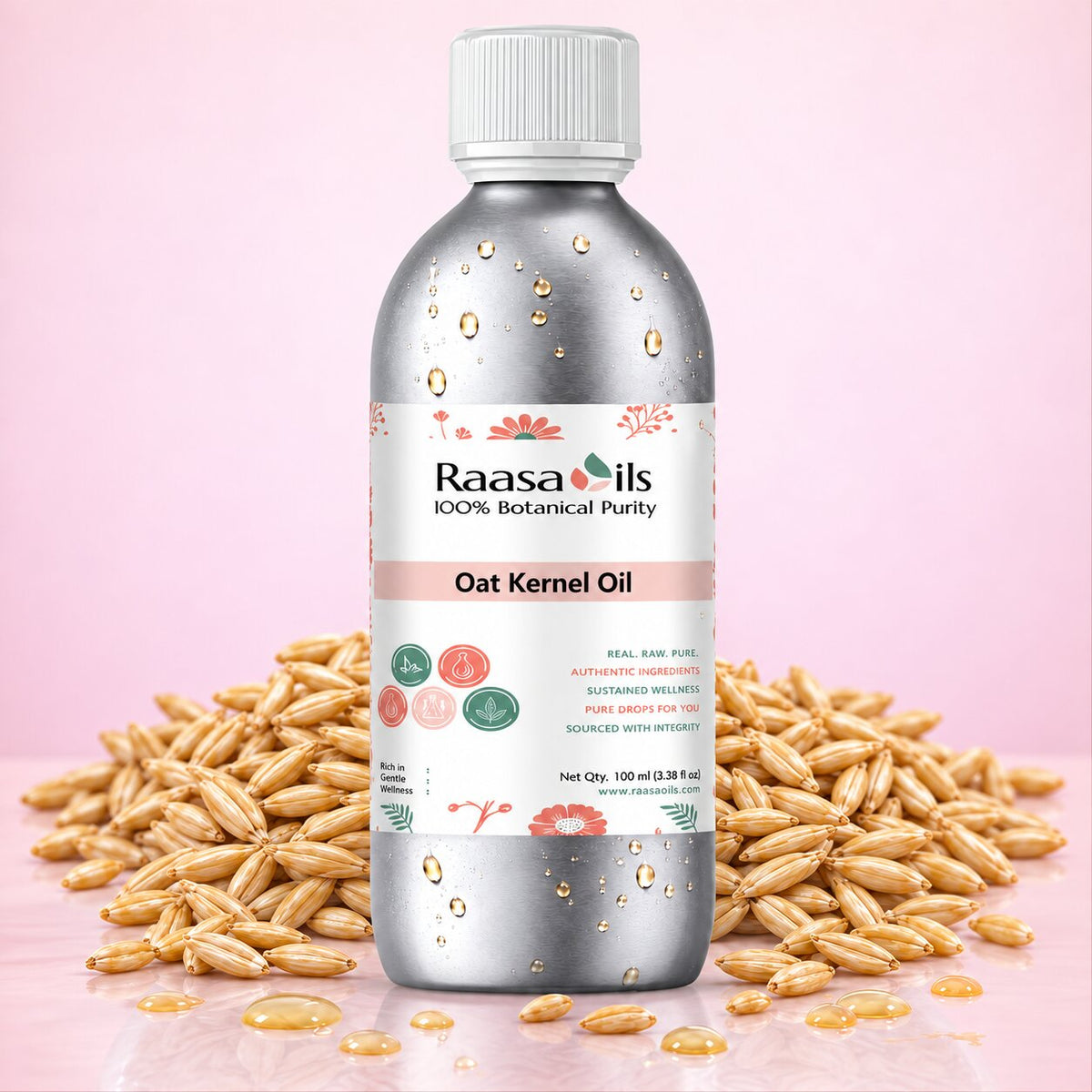 A bottle of Raasa oils Oat Kernel Oil centered on a pink background, surrounded by scattered oat kernels. The bottle is metallic silver with a white cap and a white label featuring pink and green accents.