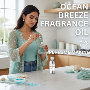 Woman in a kitchen holding a bottle of ocean breeze fragrance oil with text overlay.