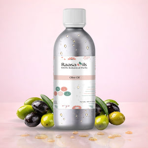 Bottle of Raasa Oils olive oil with olives on a pink background