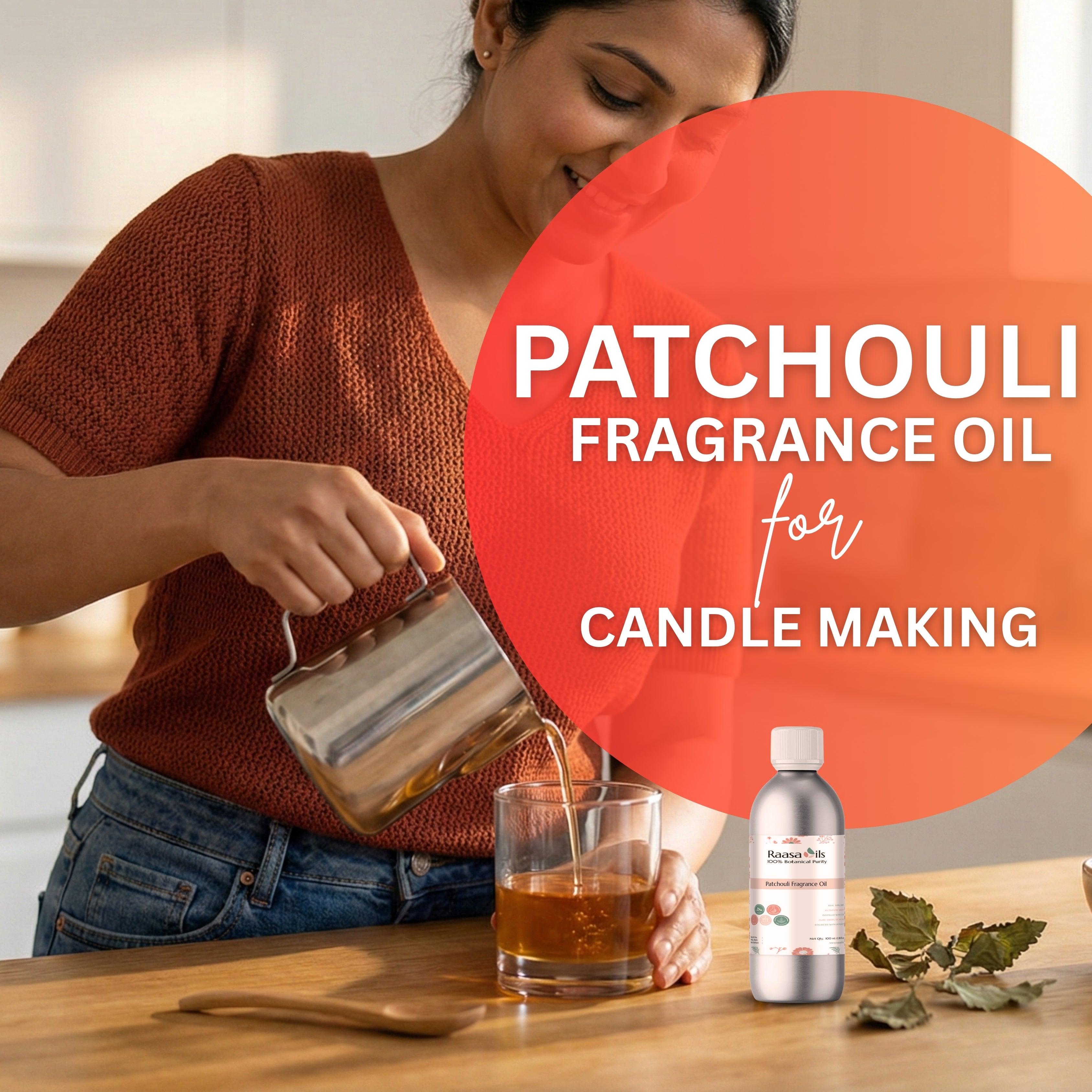 Woman pouring liquid into a glass with a bottle of patchouli fragrance oil and leaves on a wooden surface.