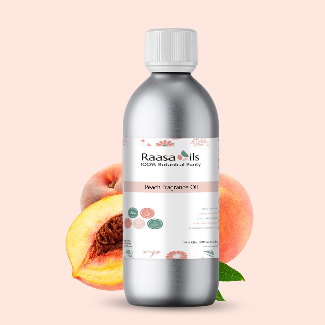 Bottle of Raasa Oils Peach Fragrance Oil with peaches and leaves on a light pink background