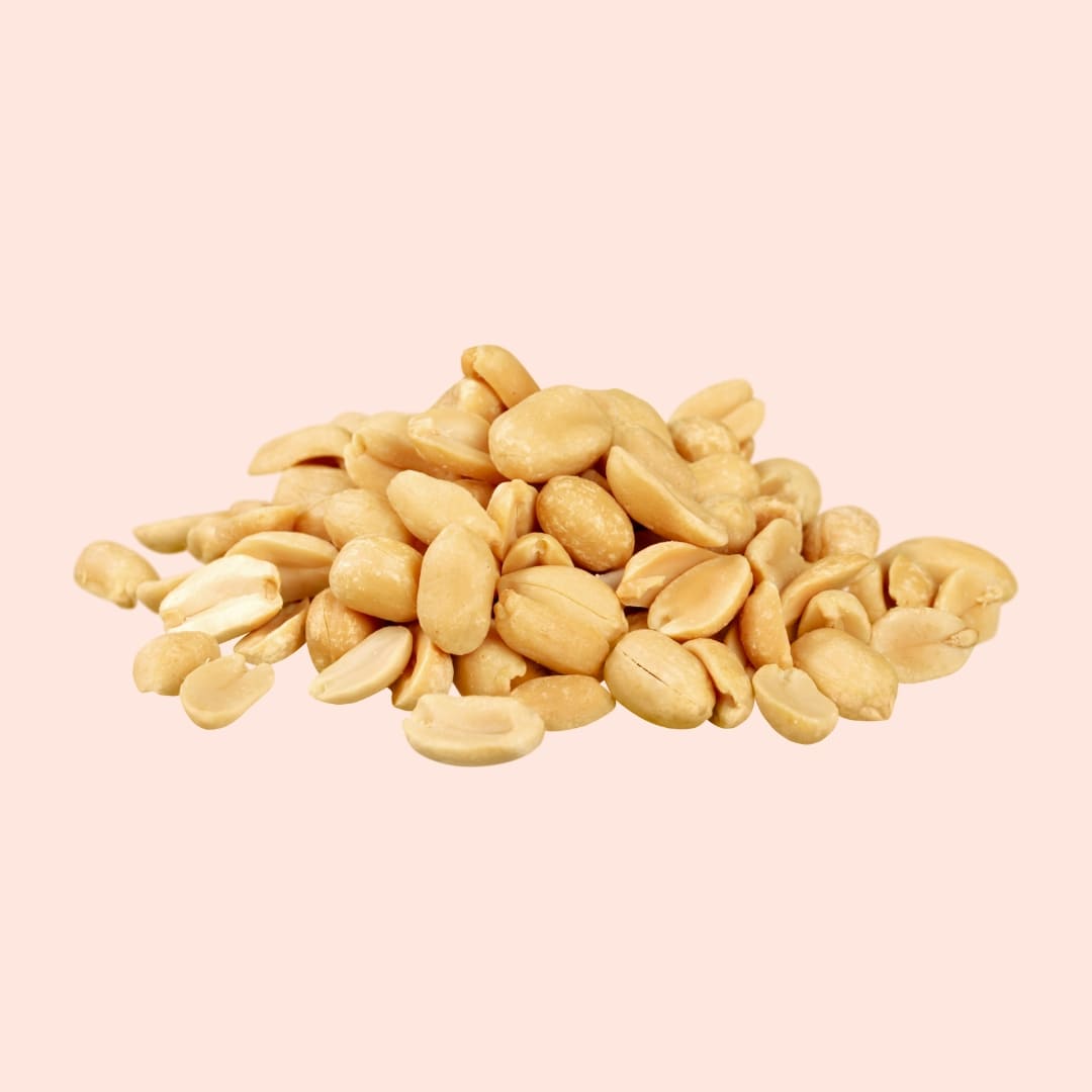 Pile of peanuts on a beige background