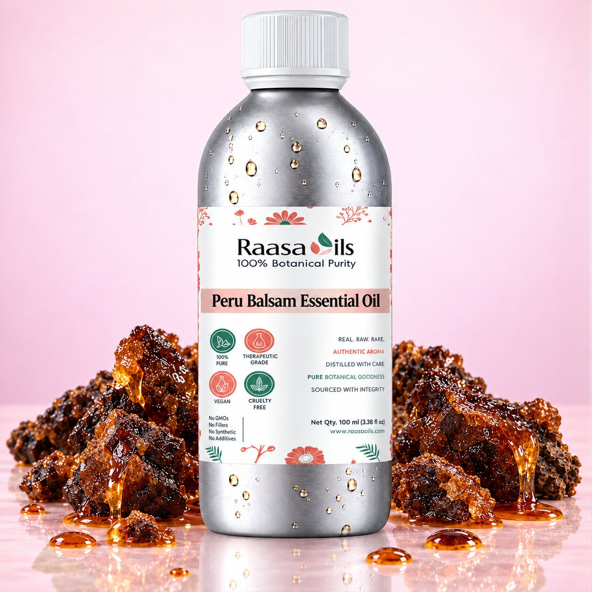 A bottle of Raasa oils Peru Balsam Essential Oil centered on a pink background, flanked by piles of dark brown resin pieces with amber liquid dripping around it. The bottle is metallic silver with a white cap and a white label featuring pink floral accents and green leaf details.