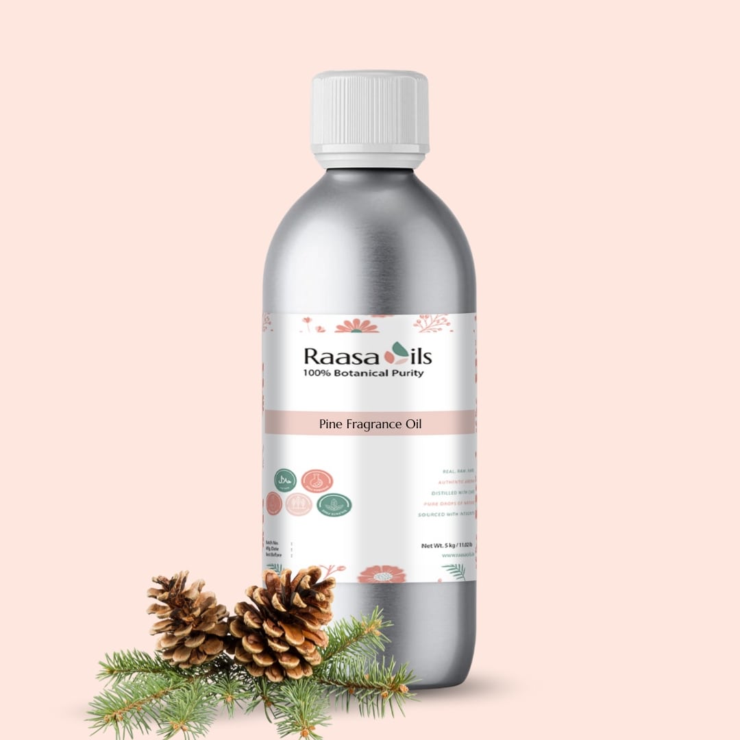 Bottle of Raasa Oils Pine Fragrance Oil with pine branches on a beige background