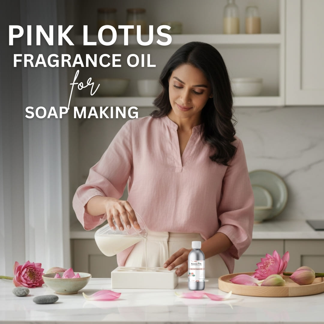 Woman in a kitchen with pink lotus flowers and a bottle of Pink Lotus fragrance oil for soap making.