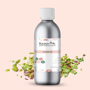Bottle of Raasa Oils Pistachio Oil with pistachios on a pink background