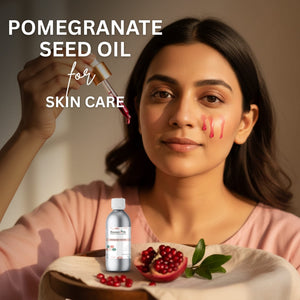 Woman with pomegranate seed oil for skin care, including a bottle and pomegranate fruit on a table.