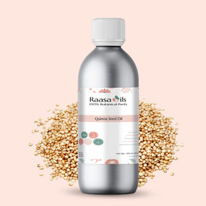 Bottle of Raasa Oils Quinoa Seed Oil with quinoa seeds on a light pink background