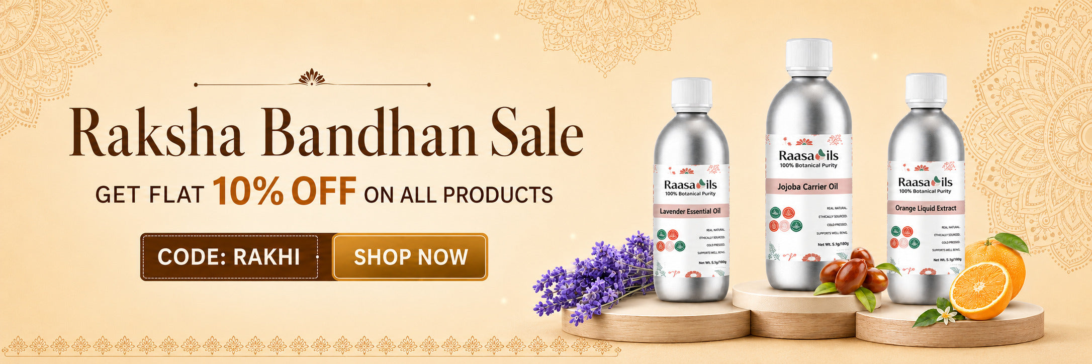 Promotional banner for Raksha Bandhan Sale featuring three silver bottles of Raksha Bandhan oil on a beige background with decorative text, a purple flower sprig, and citrus slices.
