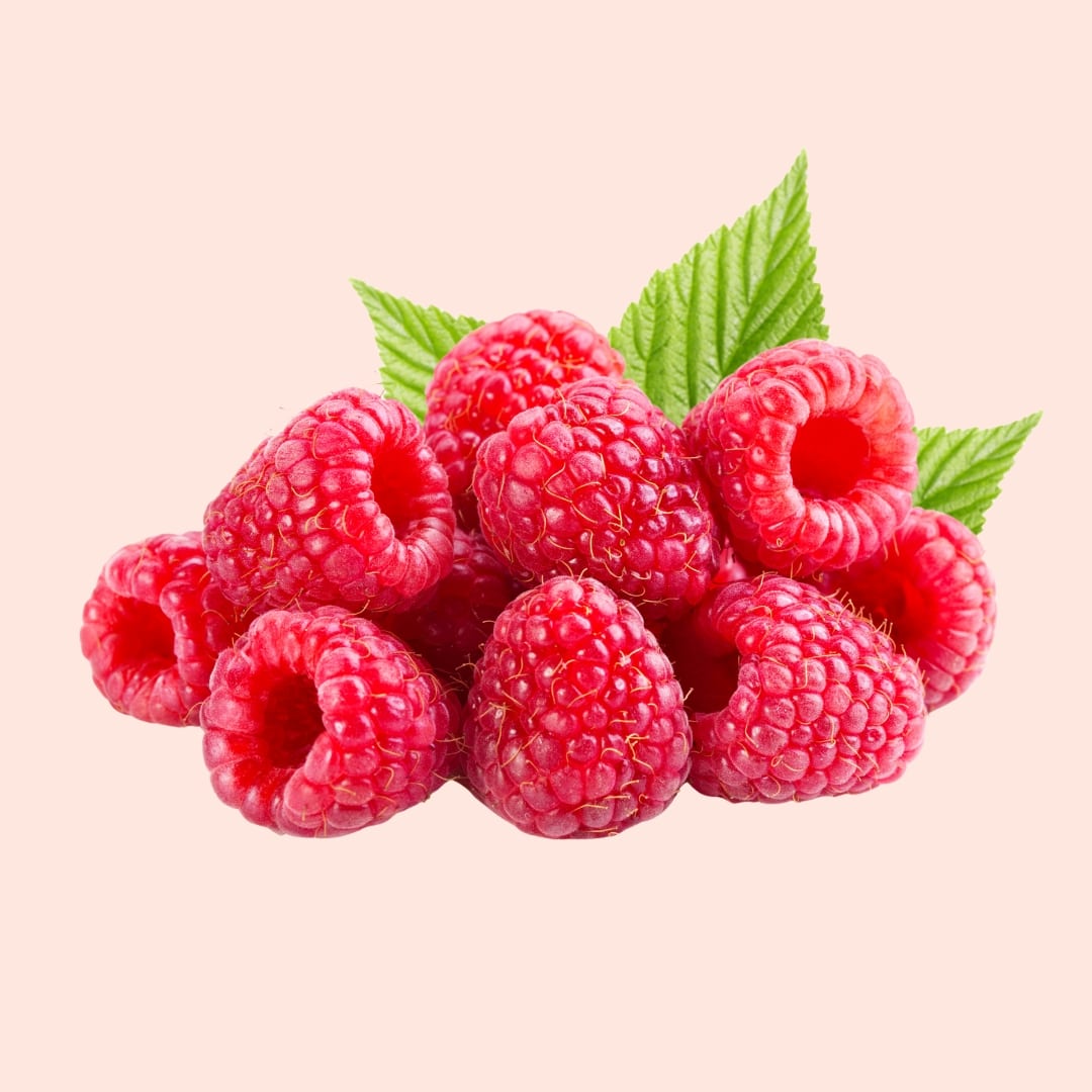 Raspberries with green leaves on a light pink background